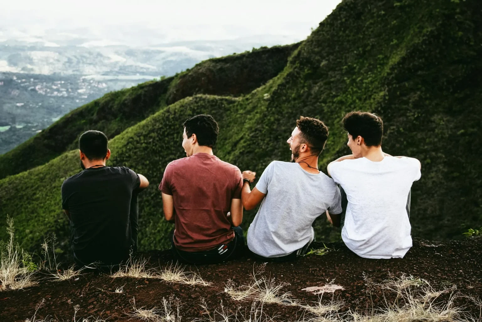 Friends are sitting on mountain