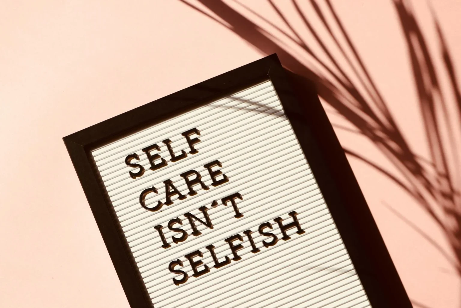 Card with sentence ,, self care isn't selfish''